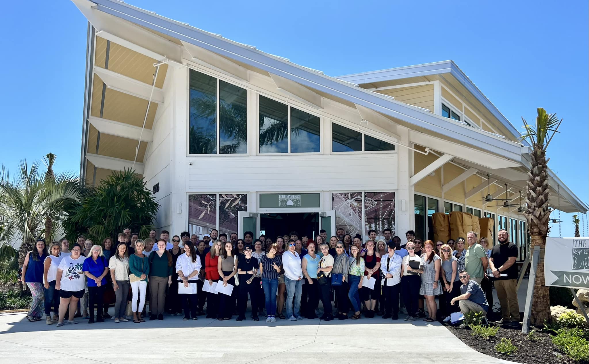 The Banyan House team standing in front of the all-new location in Downtown Wellen of Wellen Park Florida.